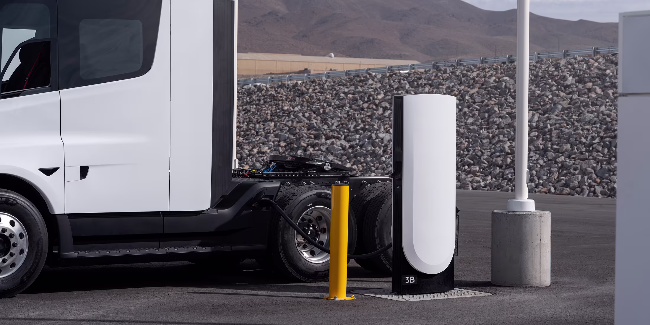 Electric Semi truck charging at a stop by the highway
